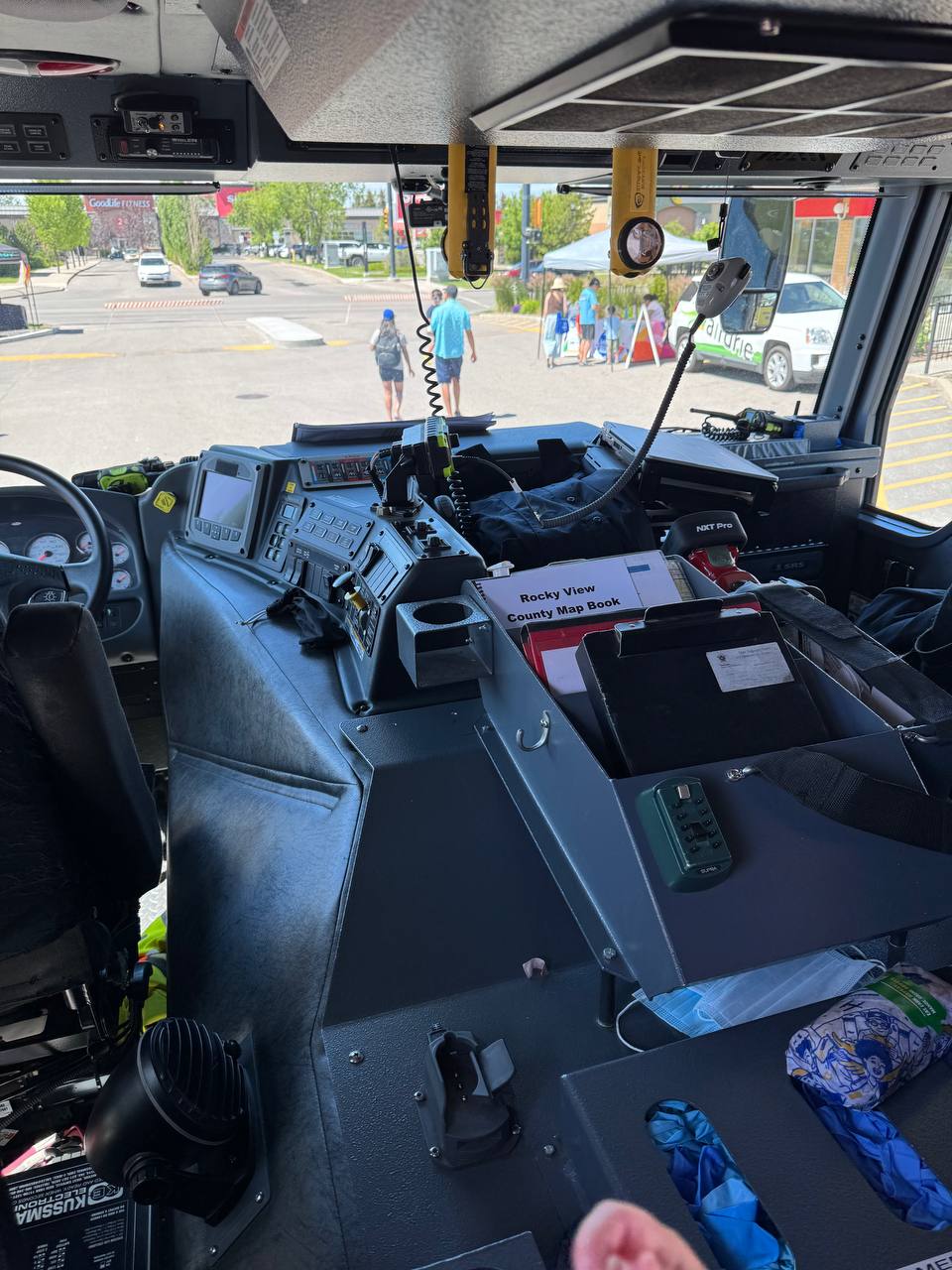 A child-sized view from inside a fire truck cockpit at the Mighty Machines event in Airdrie